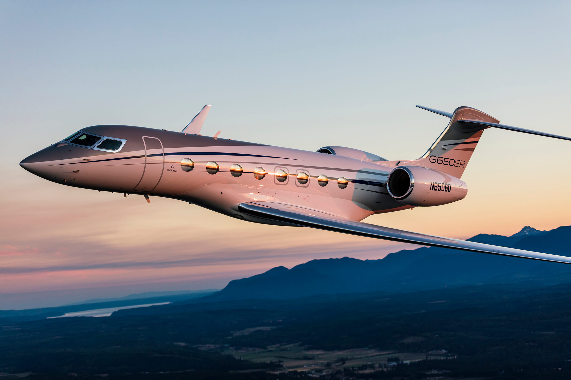 Gulfstream G650ER flying at sunset